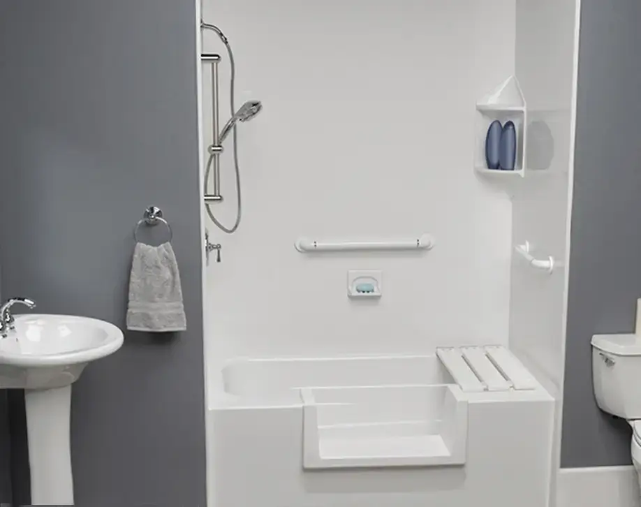 An alcove bathtub featuring a white walk-in step cutout insert modification, a matching removable slatted seat board, safety grab bars, and smooth white wall panels.