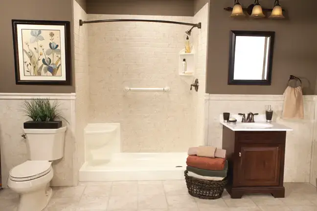 Transitional bathroom remodel showcasing a white hexagon tile bathtub surround, matte black hardware, and an elegant charcoal gray sideboard vanity with a vessel sink.